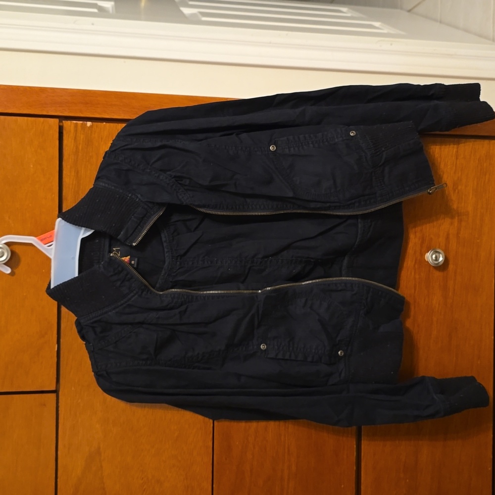 Black high neck cropped jacket.